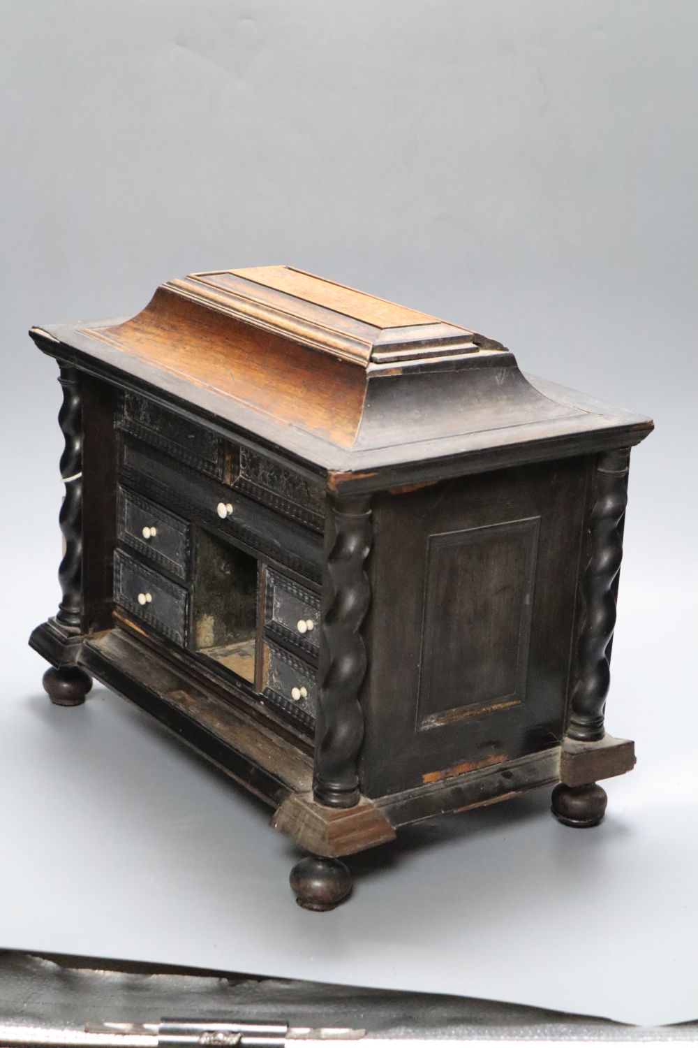 An 18th/19th century Continental ebony veneered table cabinet of drawers (modified)